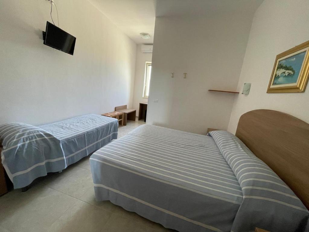 Postel nebo postele na pokoji v ubytování Hotel Ponte