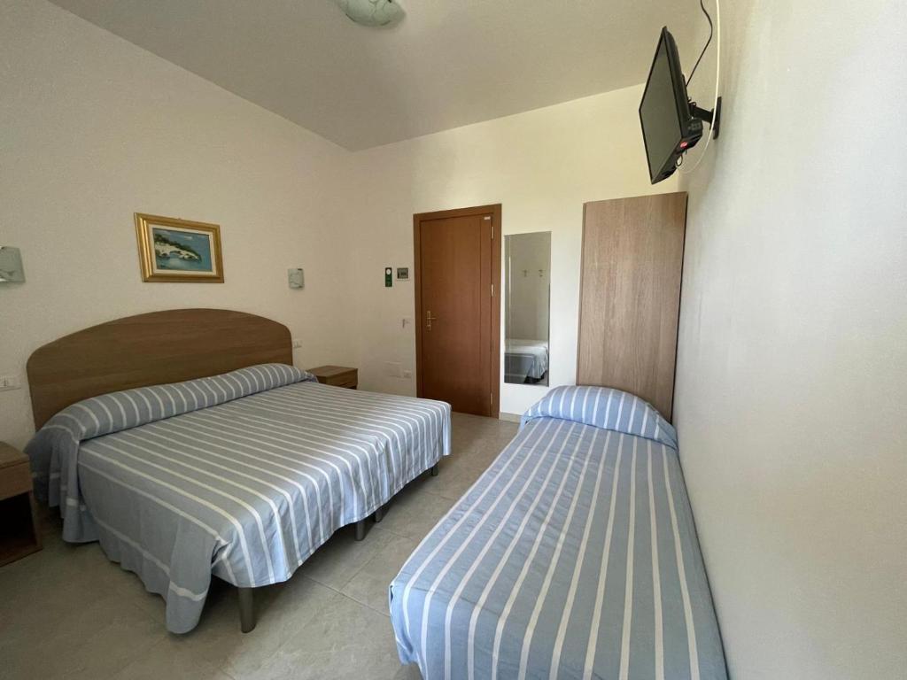 Postel nebo postele na pokoji v ubytování Hotel Ponte