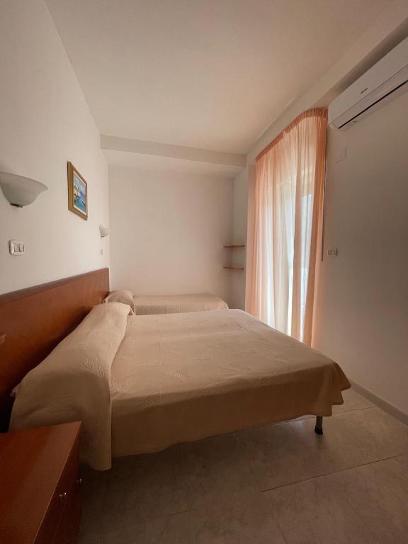 Postel nebo postele na pokoji v ubytování Hotel Ponte