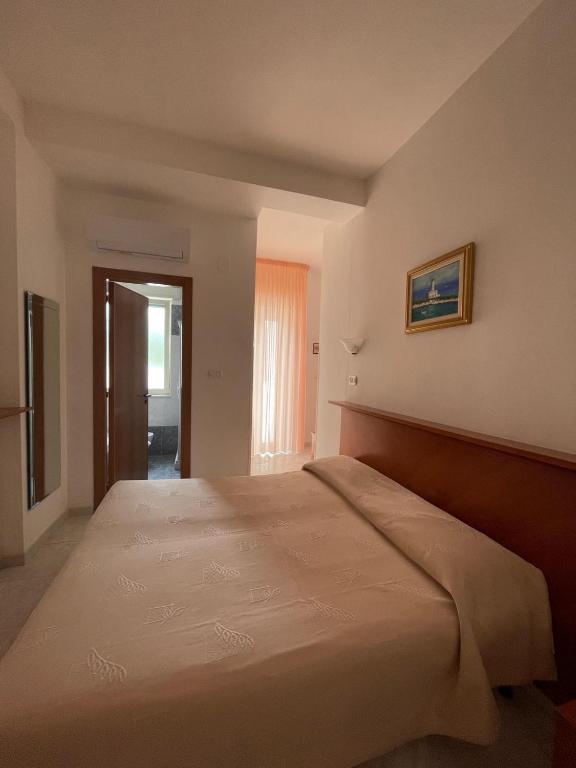 Postel nebo postele na pokoji v ubytování Hotel Ponte