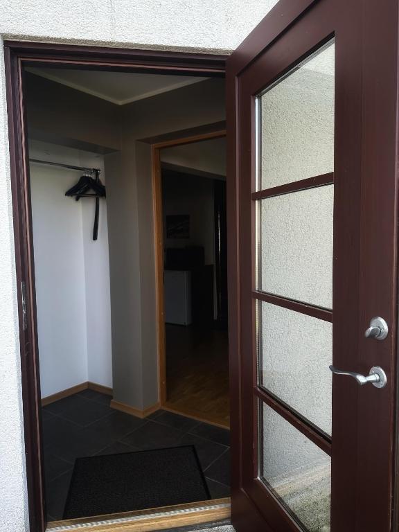 an open door to a room with a hallway at Janno apartment in Pärnu