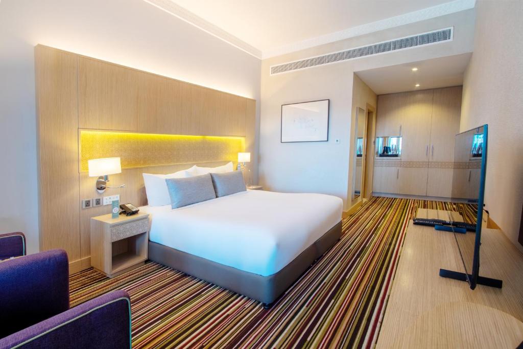 Postel nebo postele na pokoji v ubytování Dusit D2 Kenz Hotel Dubai