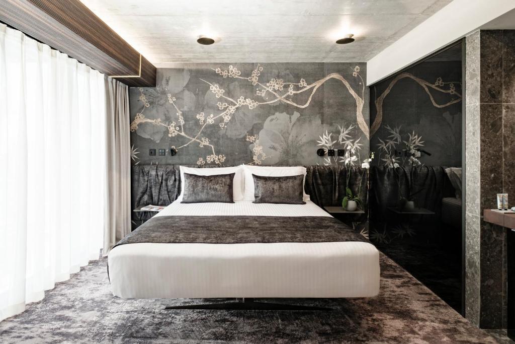 Postel nebo postele na pokoji v ubytování Fitch Hotel