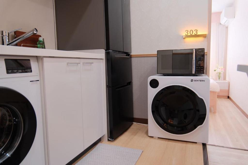 Kuchyň nebo kuchyňský kout v ubytování 桜の宿