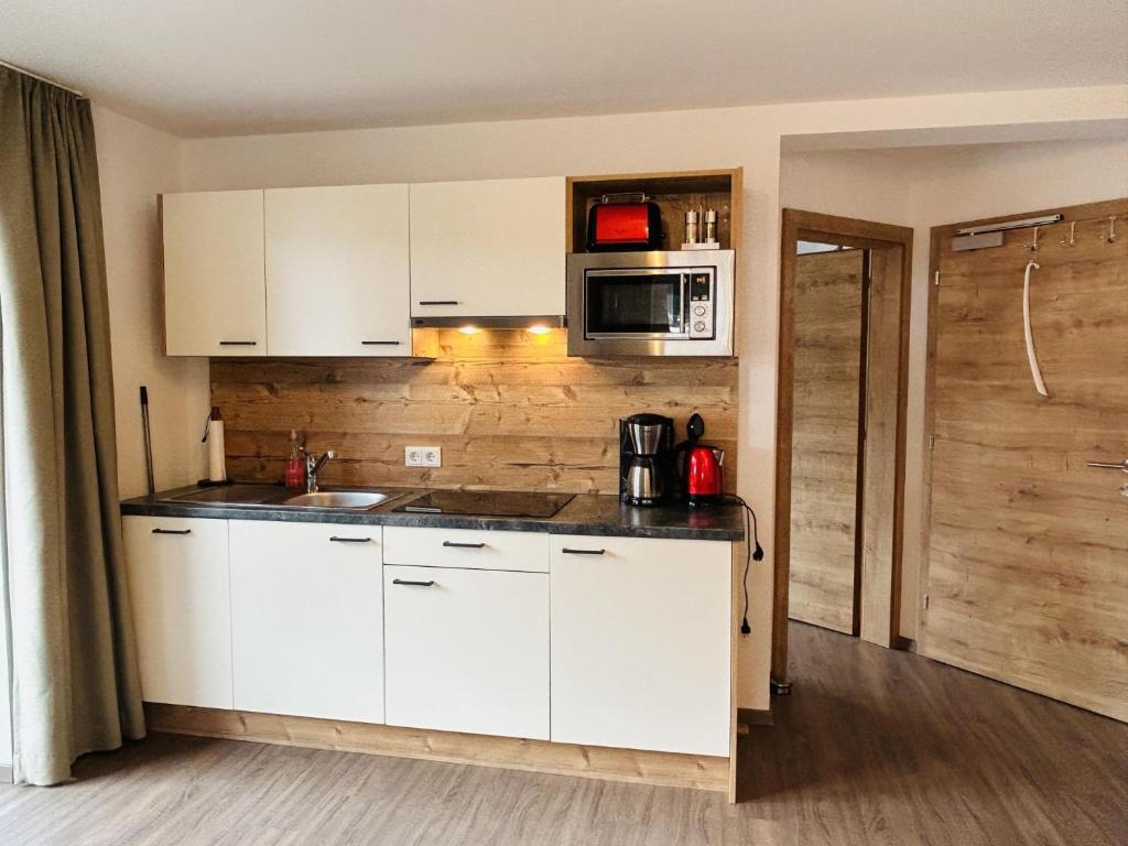 Kuchyň nebo kuchyňský kout v ubytování Mari's Landhaus