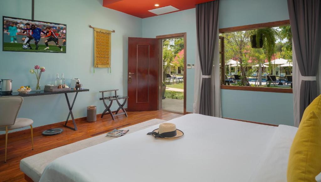 Postel nebo postele na pokoji v ubytování Sala Siem Reap Resort