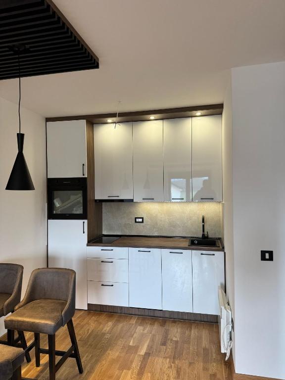 Kuchyň nebo kuchyňský kout v ubytování Apartman 53
