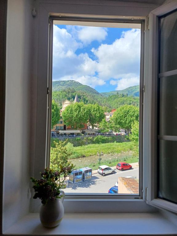 a window with a view of a city at Riverview in Sospel