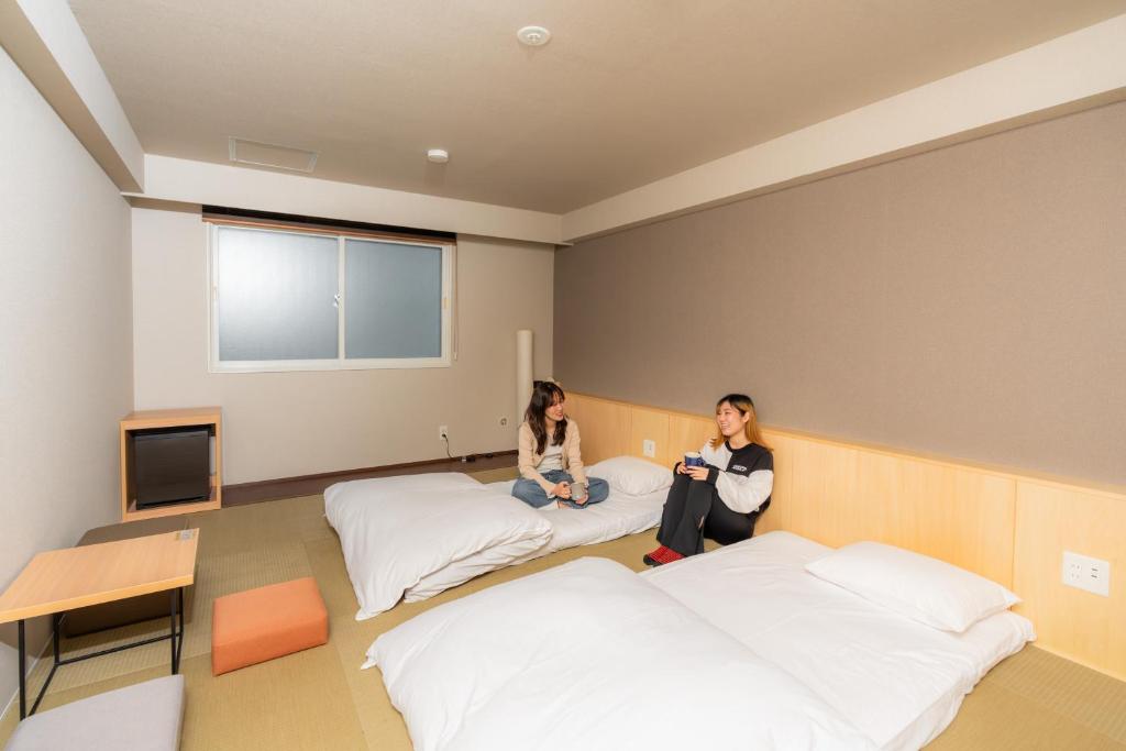 TV a/nebo společenská místnost v ubytování Grand Hostel LDK Odori Park