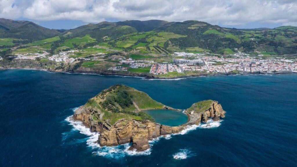 a small island in the ocean with a city at The Princess Ring View in Vila Franca do Campo