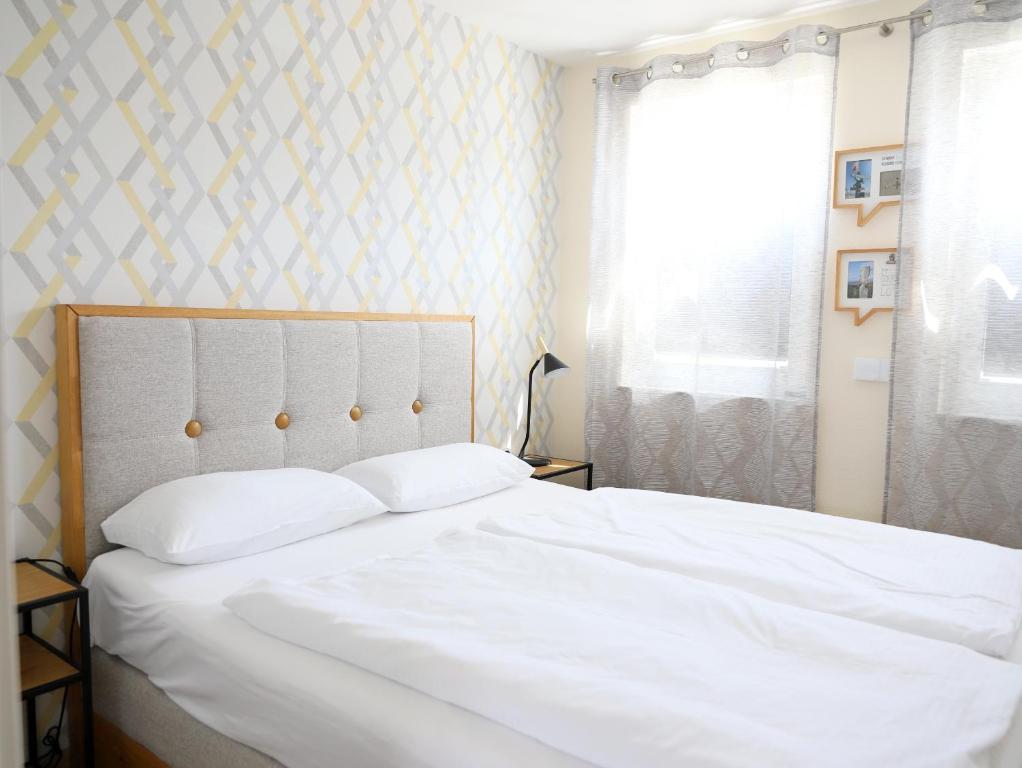 Postel nebo postele na pokoji v ubytování Dünengrund 3, W5, liebeUNDträume