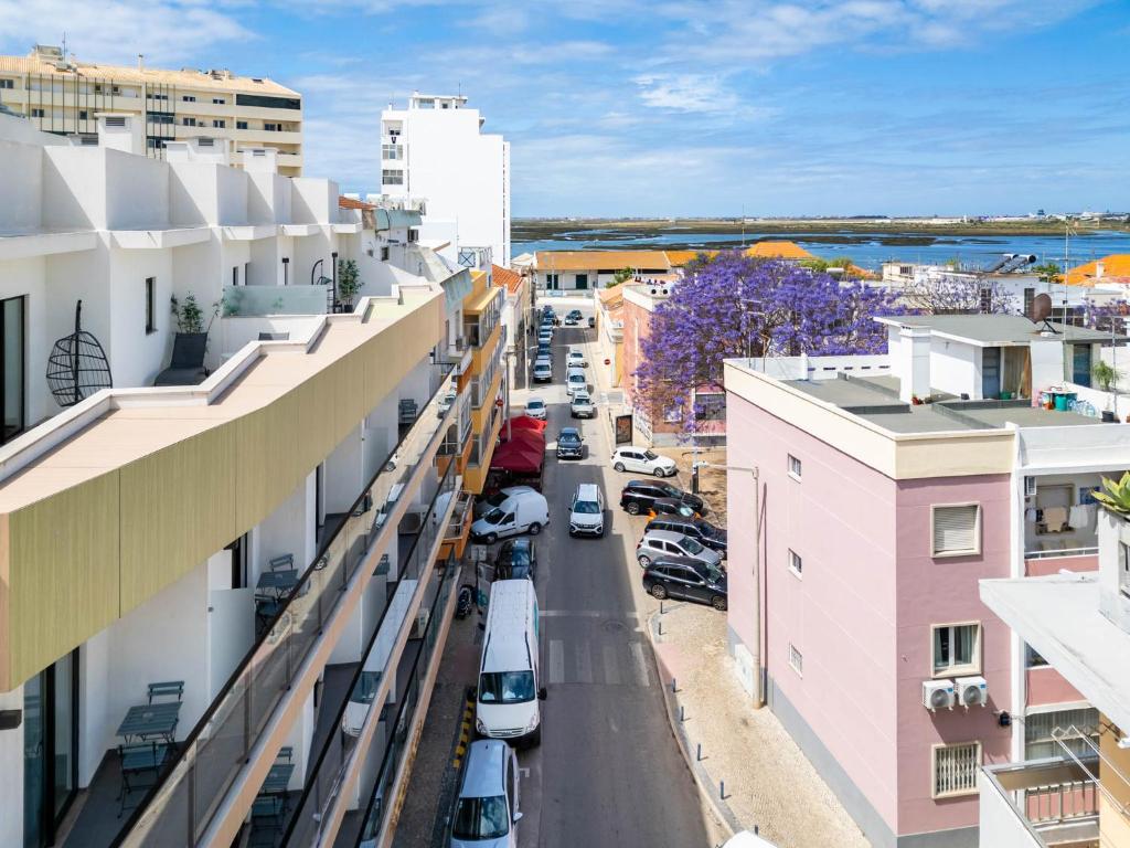 an aerial view of a city street with buildings at Roots Hotel in Faro