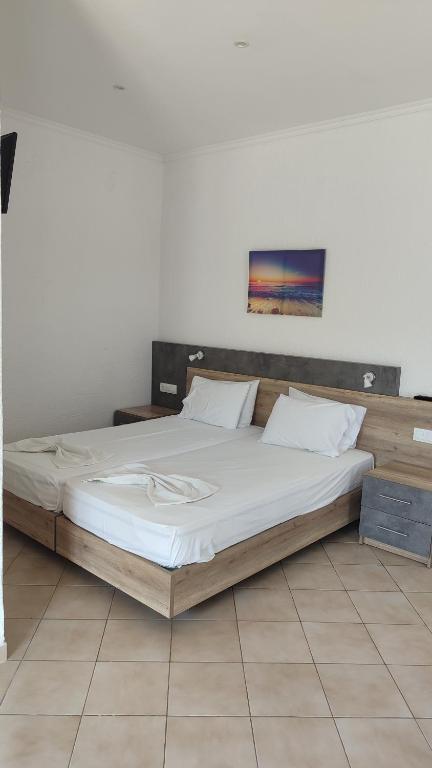 Postel nebo postele na pokoji v ubytování Smaragda Hotel