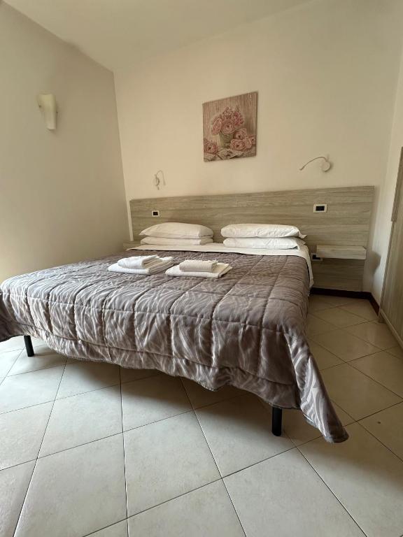 Postel nebo postele na pokoji v ubytování Le Corti Del Lago