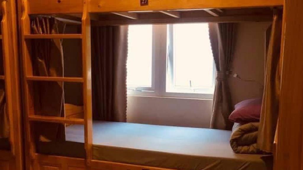 Letto o letti in una camera di Dalat Peace Backpackers Hostel
