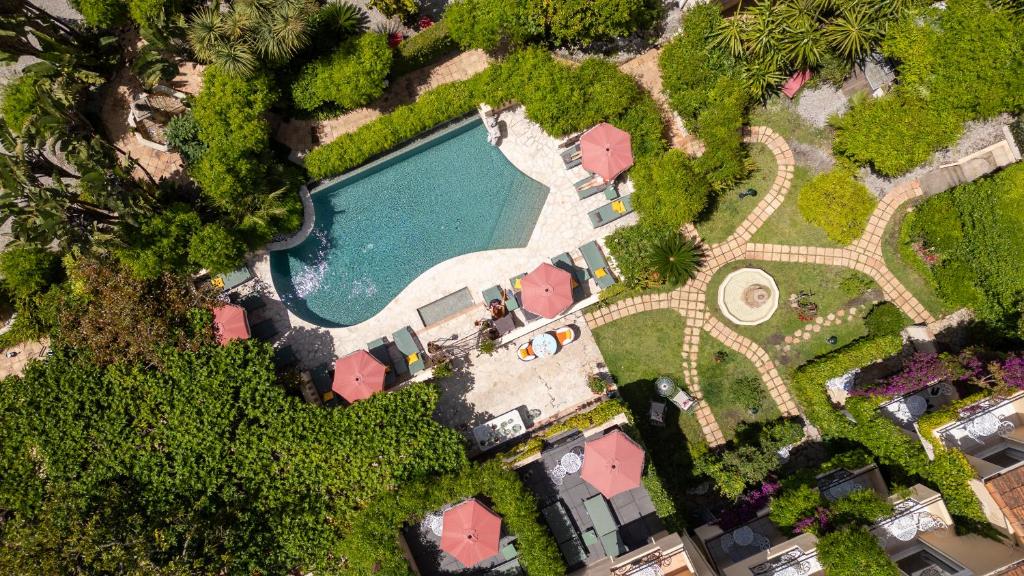 an overhead view of a swimming pool in a park at Hôtel La Villa Sainte Valérie Adults Only in Juan-les-Pins