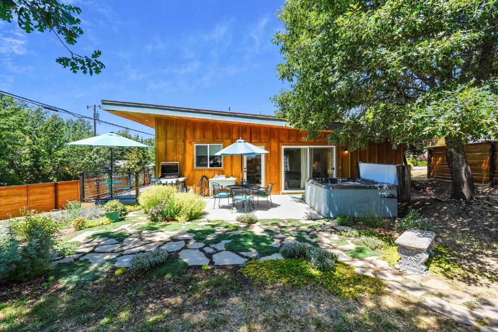 a home with a patio and a house at Celias Garden in Graton