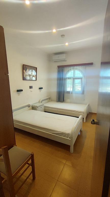 Postel nebo postele na pokoji v ubytování Smaragda Hotel