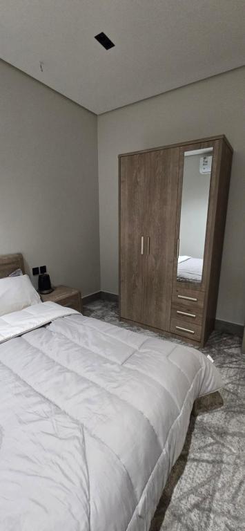 Postel nebo postele na pokoji v ubytování البيت بيتك
