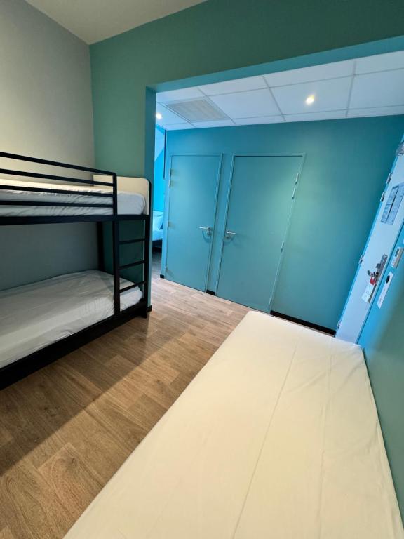 Postel nebo postele na pokoji v ubytování ibis budget Nancy Laxou