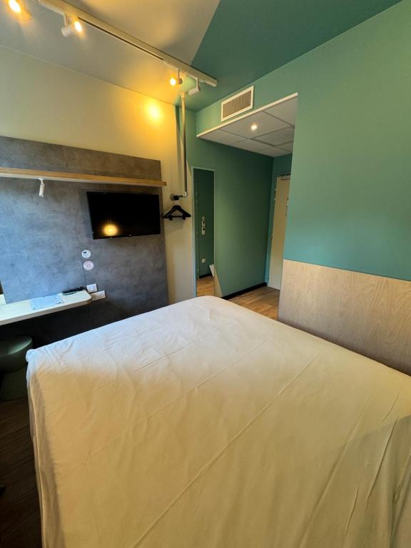 Postel nebo postele na pokoji v ubytování ibis budget Nancy Laxou