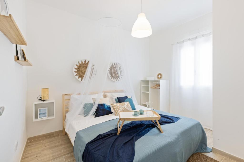 Posteľ alebo postele v izbe v ubytovaní Casa un Tocco di Blu con piscina privata
