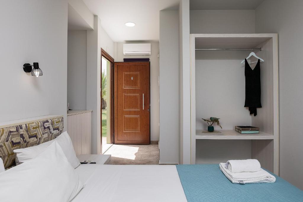 Postel nebo postele na pokoji v ubytování La Palma Beachfront Suites