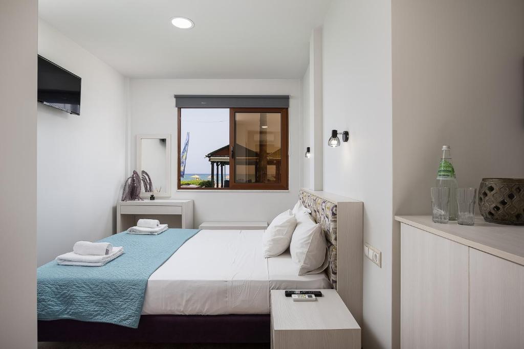 Postel nebo postele na pokoji v ubytování La Palma Beachfront Suites