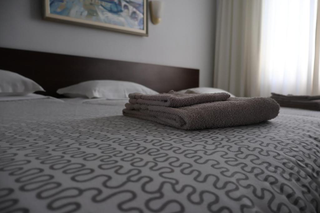 Postel nebo postele na pokoji v ubytování Family Hotel Avramov