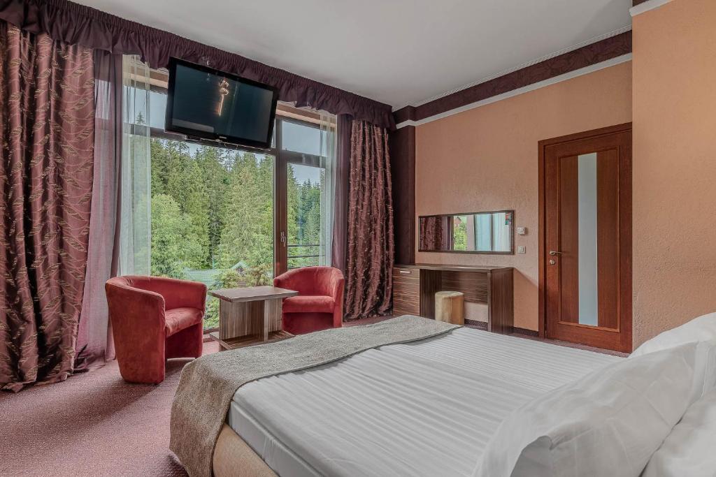 Postel nebo postele na pokoji v ubytování Bukovel Apart