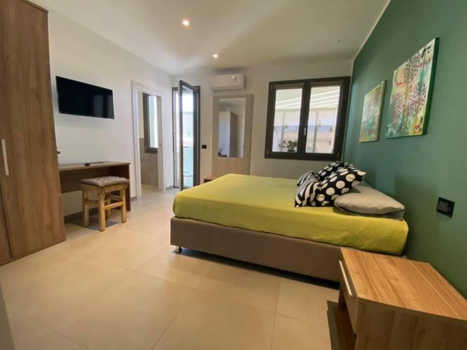 A bed or beds in a room at SOLUS B&B