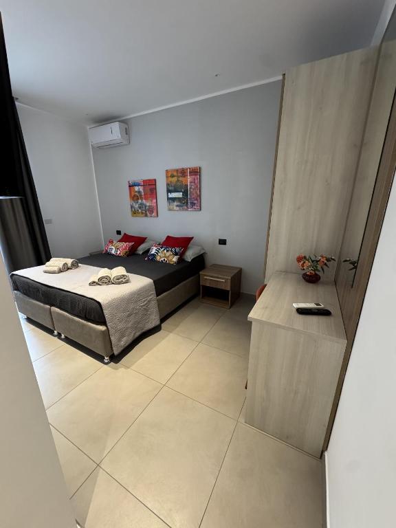 A bed or beds in a room at SOLUS B&B
