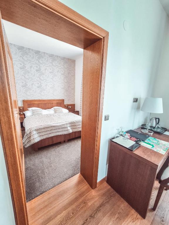 Postel nebo postele na pokoji v ubytování Hotel Mario