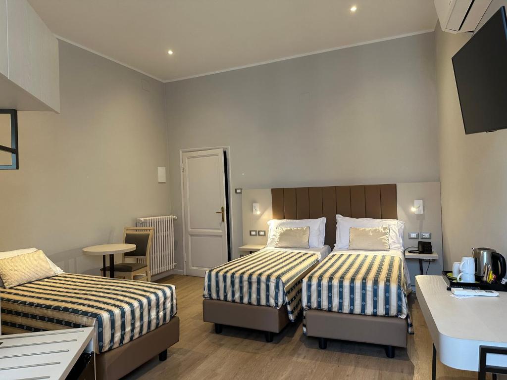 Postel nebo postele na pokoji v ubytování Hotel Giappone