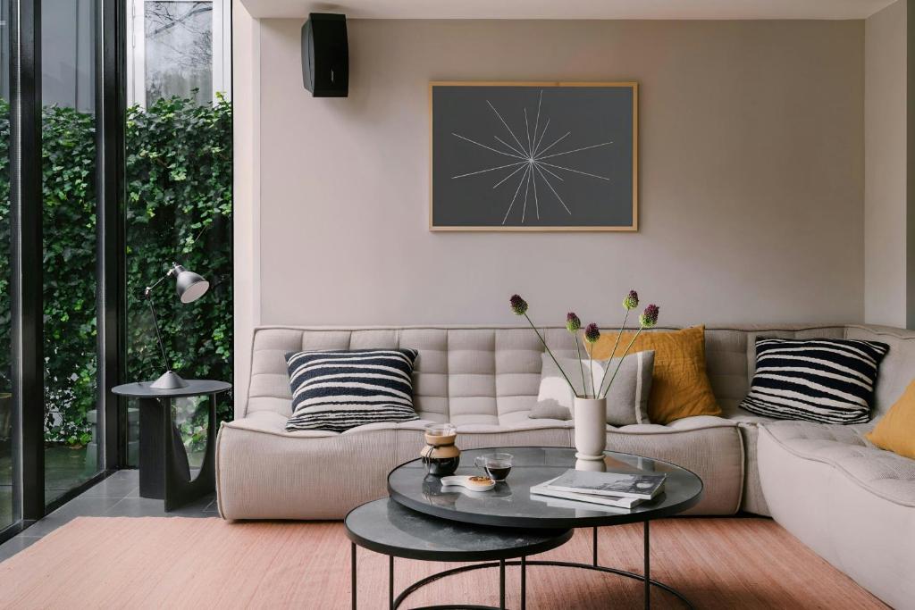 a living room with a couch and a table at Park House Hotel Museum Quarter, Sonder by Marriott Bonvoy in Amsterdam