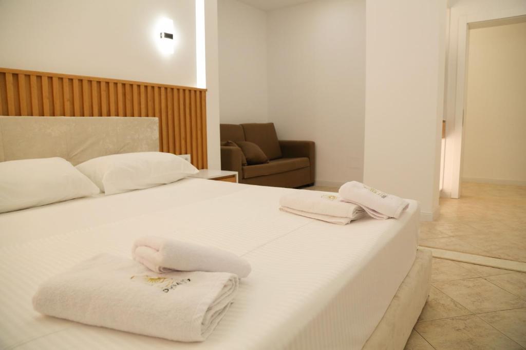 Postel nebo postele na pokoji v ubytování Primus Hotel
