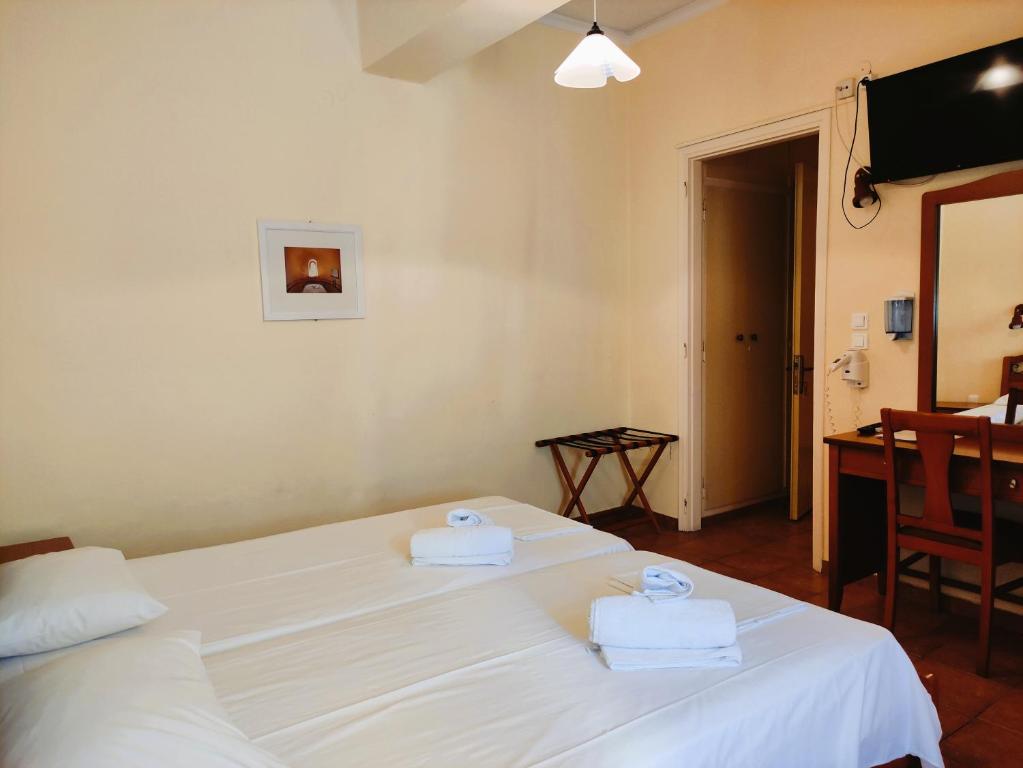 Postel nebo postele na pokoji v ubytování A Hotel Faros