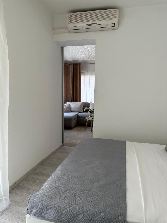 Postel nebo postele na pokoji v ubytování Apartments Olga 2