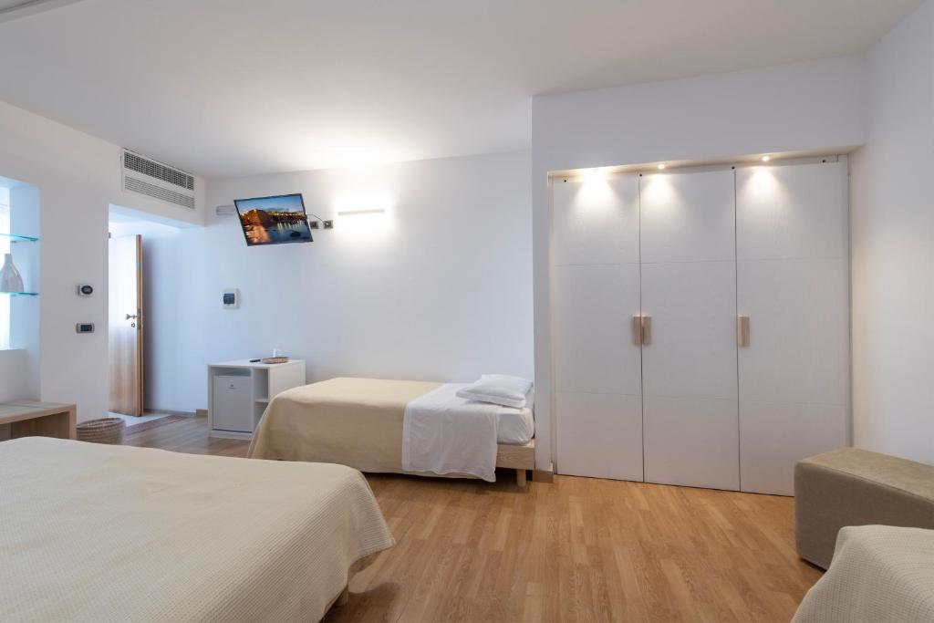 Postel nebo postele na pokoji v ubytování Hotel Albània