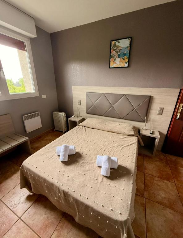 Postel nebo postele na pokoji v ubytování Hôtel - Pub Le Petit Bosquet