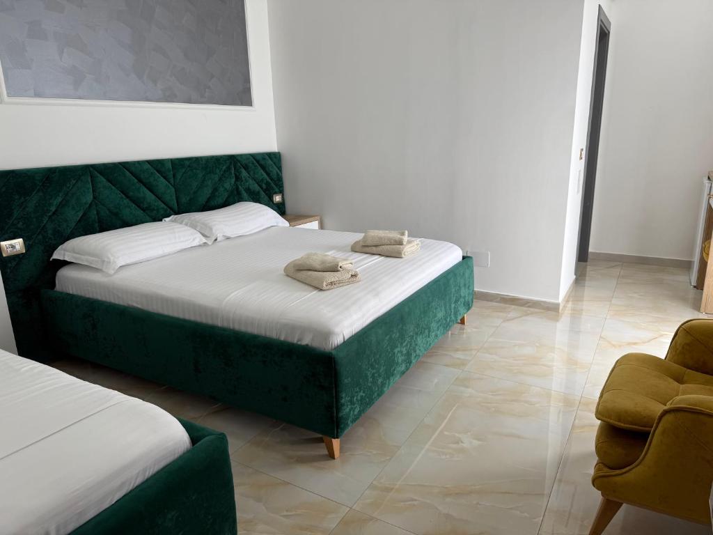Postel nebo postele na pokoji v ubytování Hotel Leodori 1
