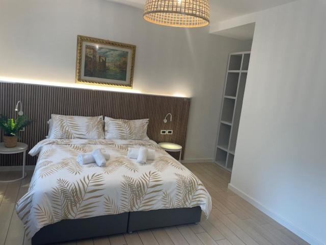 A bed or beds in a room at Hotel La Pergola di Venezia