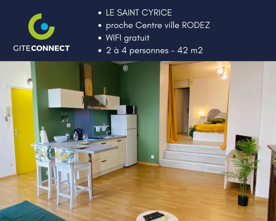 Una cocina con una mesa y un mostrador en una habitación. en LE SAINT CYRICE, en Rodez