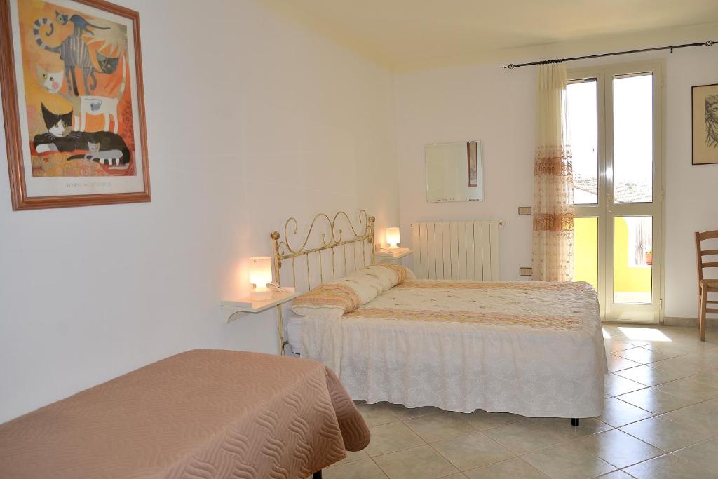 Postel nebo postele na pokoji v ubytování B&B S'Incontru
