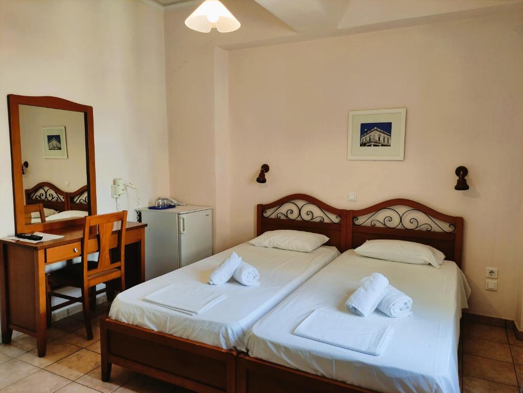 Postel nebo postele na pokoji v ubytování A Hotel Faros