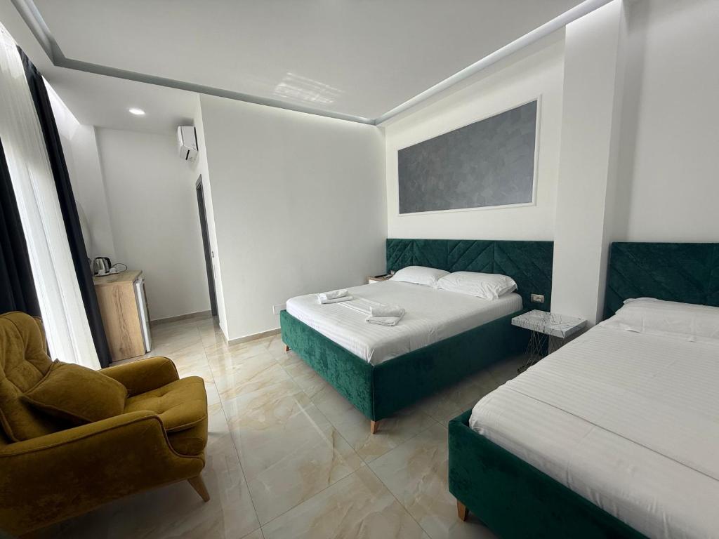 Postel nebo postele na pokoji v ubytování Hotel Leodori 1