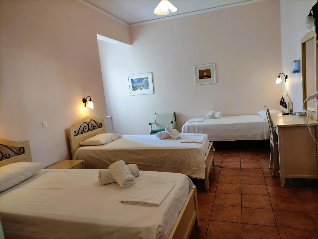 Postel nebo postele na pokoji v ubytování A Hotel Faros