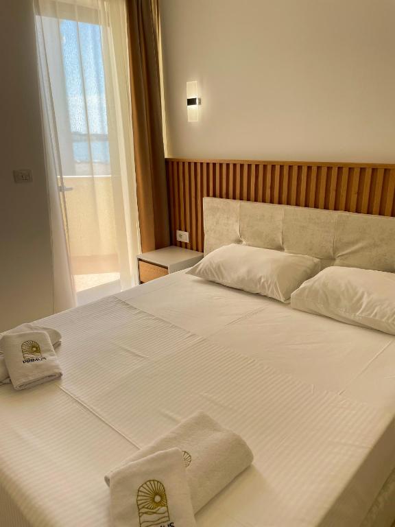 Postel nebo postele na pokoji v ubytování Primus Hotel