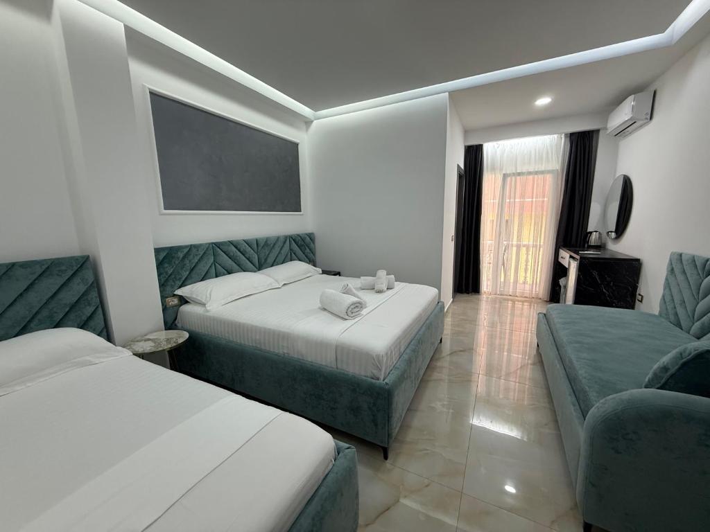 Postel nebo postele na pokoji v ubytování Hotel Leodori 1