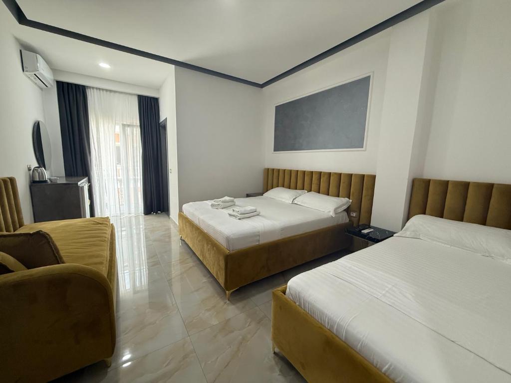 Postel nebo postele na pokoji v ubytování Hotel Leodori 1